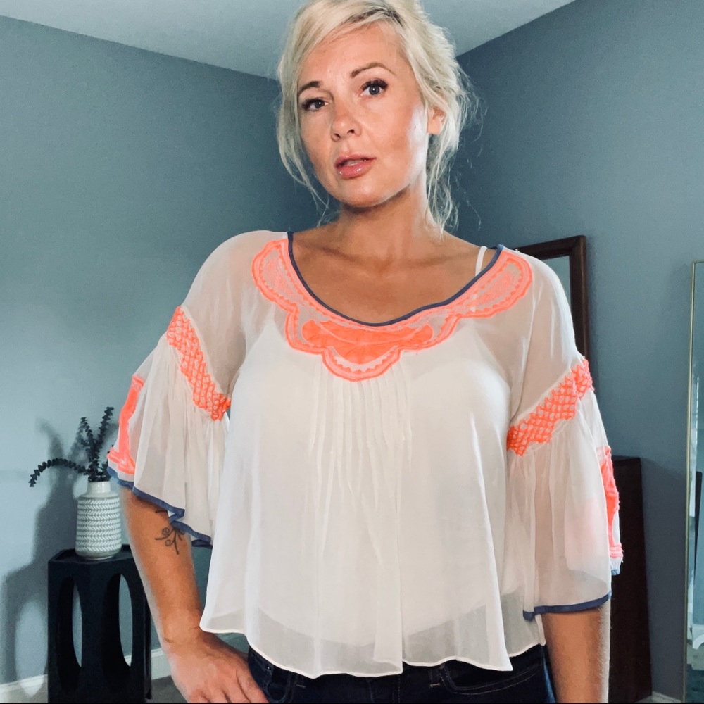 Sheer bell sleeve top with neon orange accents